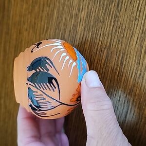 Small terra cotta pot with hand painted palm & sun scene perfect condition